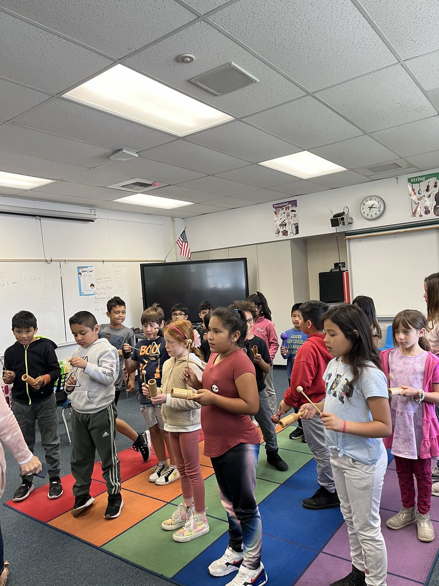 MsSlattum's tweet photo. We had fun singing and playing percussion instruments today! Retired volunteer teacher, Mrs. Ferkin leading room 5 @MadronaMustangs in all kinds of fun🎶 https://t.co/sT51ikwG9U