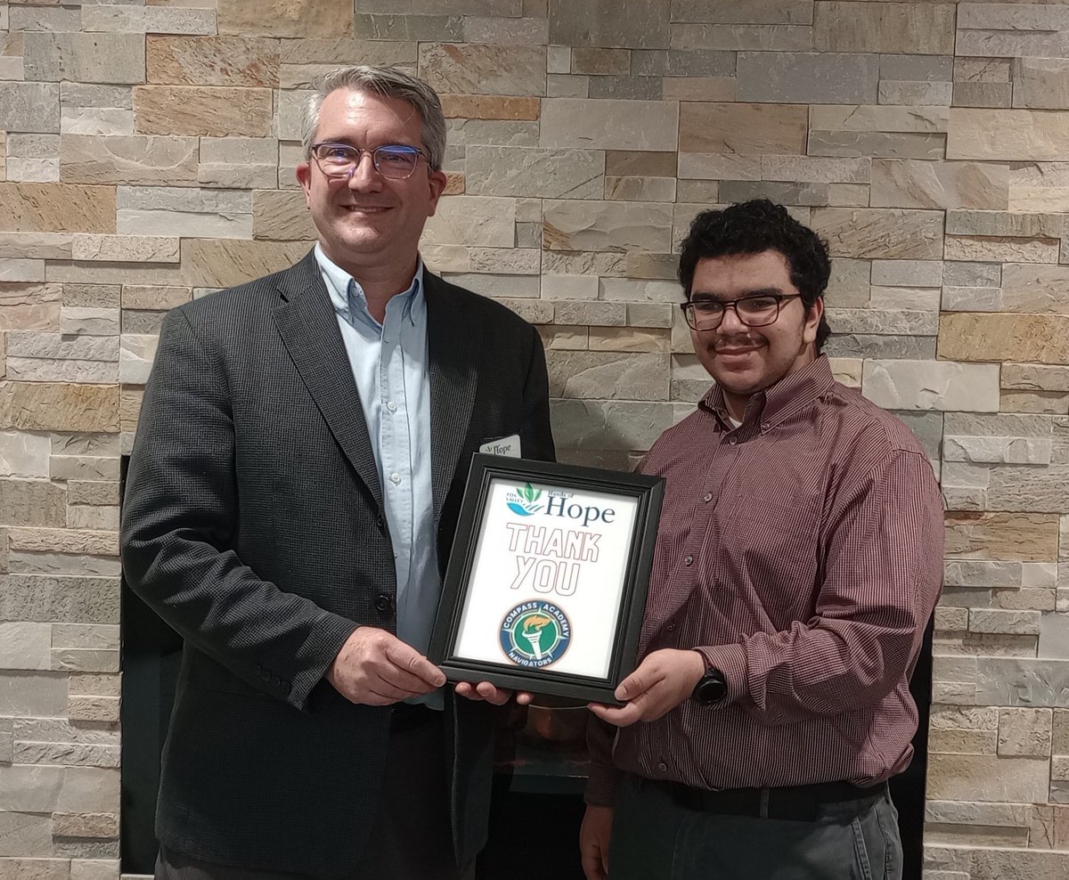 Compass Academy student, Jerry Stamos, presented <a href="/FVHandsofHope/">Fox Valley Hands of Hope</a> with a framed note of appreciation at their ribbon cutting ceremony for their generous donation of a color printer for student use. #CommunityConnections