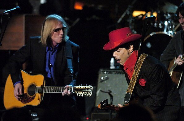 crockpics's tweet photo. Tom Petty and Prince honoring George Harrison at his Rock and Roll Hall of Fame induction, 2004. Photo by Timothy Clary https://t.co/HYMkqjdQ7o