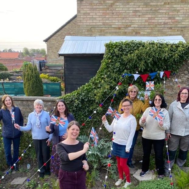 Our  Malton WI Coronation garden is officially open! A huge thank you to all  our members for their efforts in creating hundreds of pom poms for our  #malton in bloom garden decorations. Don't forget to pop by and take a  look. #womensinstitute #maltoninbloom  <a href="/MaltonWI/">Malton WI</a>