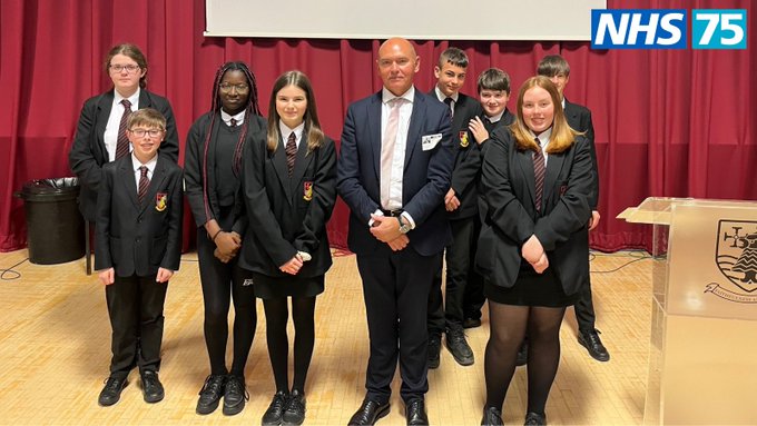 Sir James Mackey pictured with 8 students from Hebburn Comprehensive School.