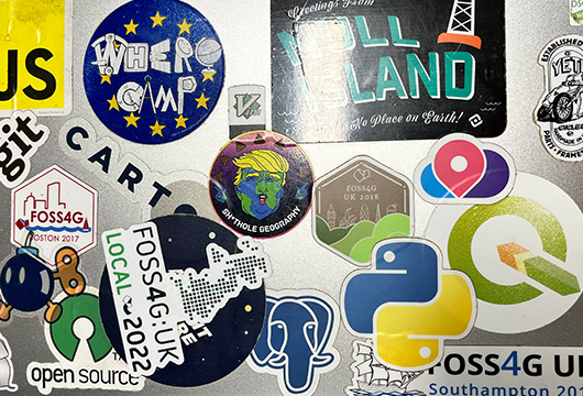 astuntech's tweet photo. "Tell me you work in GIS without telling me you work in GIS". It's a valiant effort by Matt's laptop, as spotted at our company 'do' last week.

Is there a better collection of #opensource #GIS stickers out there? 

#GISchat #stickerenvy #osgeo https://t.co/RZQSNQCAJg