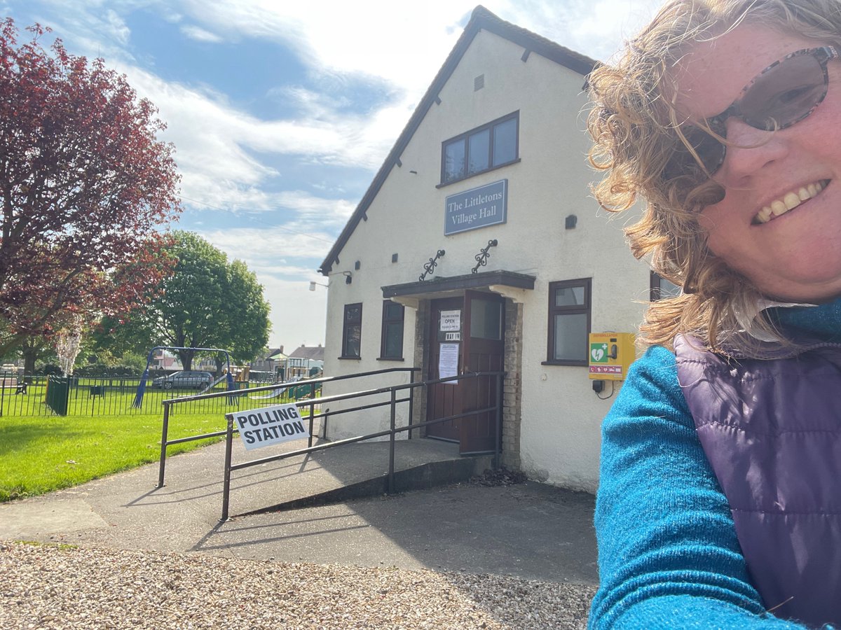 Hannah Robson, your Green councillor up for re-election, waiting with a smile for you to vote at Littletons Village Hall