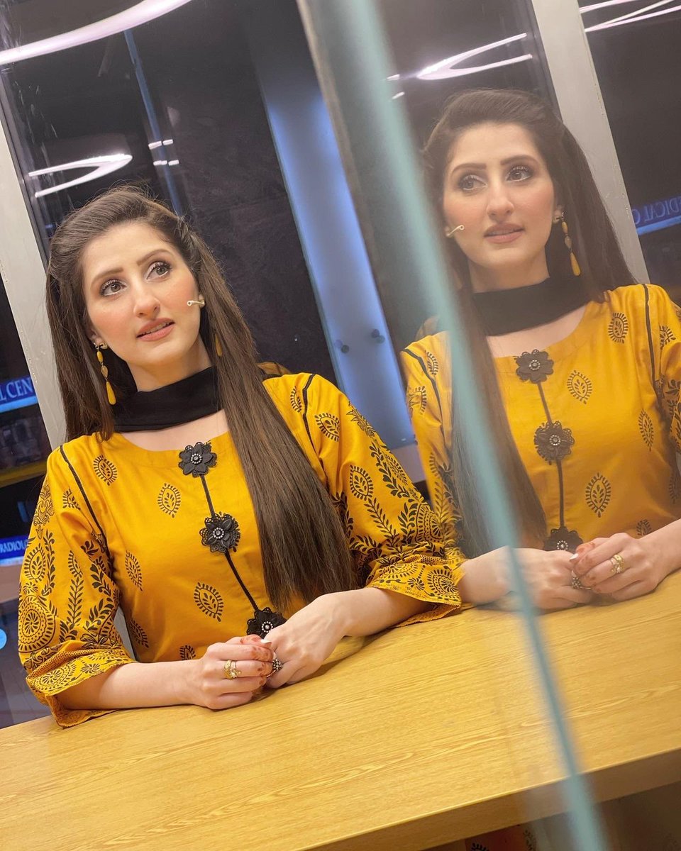 MediaSpringPk's tweet photo. BTS! @DrArooba1 stuns in a buttercup yellow outfit with black floral-inspired patterns as she graces the #OpenMicCafe set for a recording session. https://t.co/Glr9rGLCQw