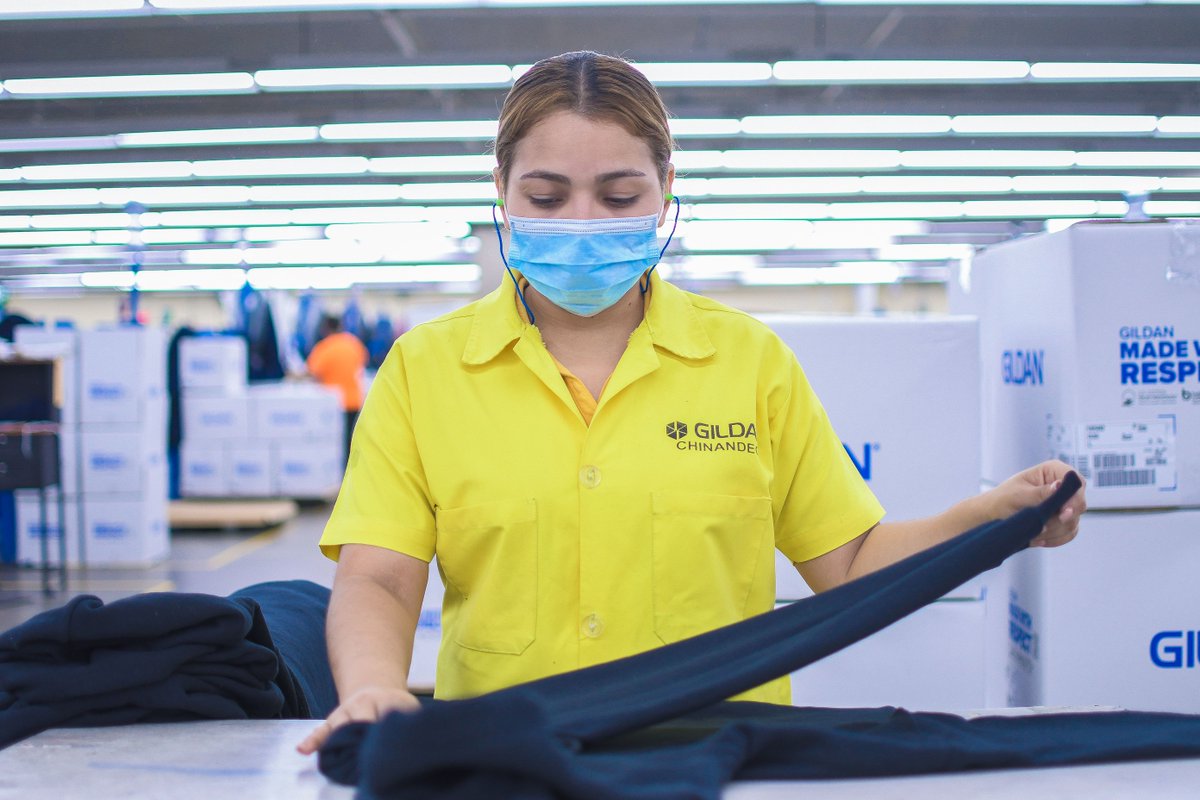 gildancorp's tweet photo. After our fabric gets sewn into our end products, our auditors inspect the final garment to ensure it's ready to be packaged and sent to our distribution centres. Mariela is one of our many sewing auditors in Nicaragua, and has been doing just that for 2 years! #IMadeYourClothes https://t.co/Bw0T9ccsUC