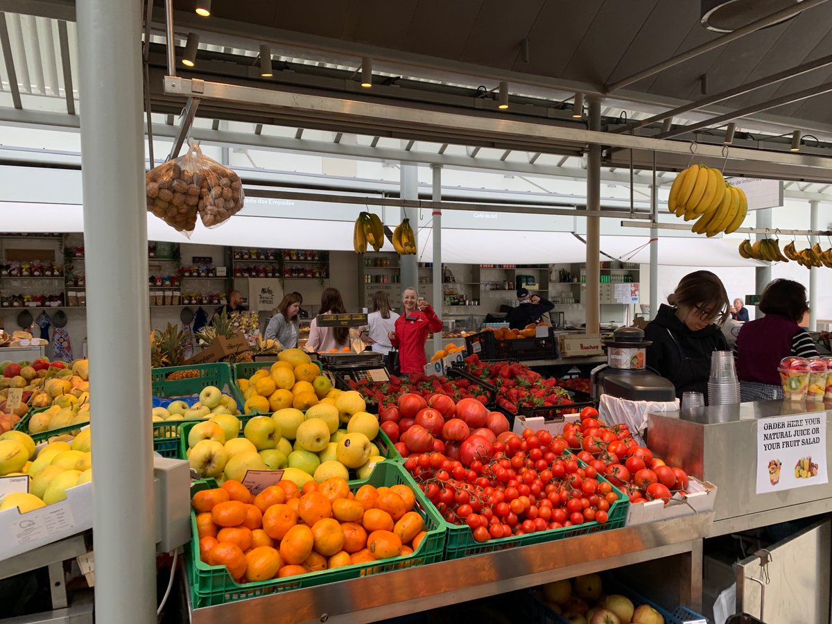 Richardersk's tweet photo. Just a Thursday lunchtime at a market in Porto, Portugal. Locals and tourists alike buying their fruit, veg, meat, wine, pastries at reasonable prices, no shortages here. I wonder why this could be ? https://t.co/F2MBvCcMQf