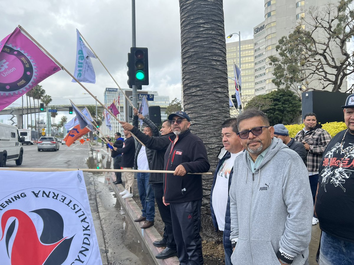 GigUnionSoCal's tweet photo. We’re rallying near LAX w/ gig drivers from across the LA area and speaking out against unsafe working conditions that are driven by poverty wages and unfair deactivations!
 
Gig workers in Chicago, Denver, NYC, SF, and Seattle are holding similar rallies! #UberDriversUnite https://t.co/NGl1pD7LSG