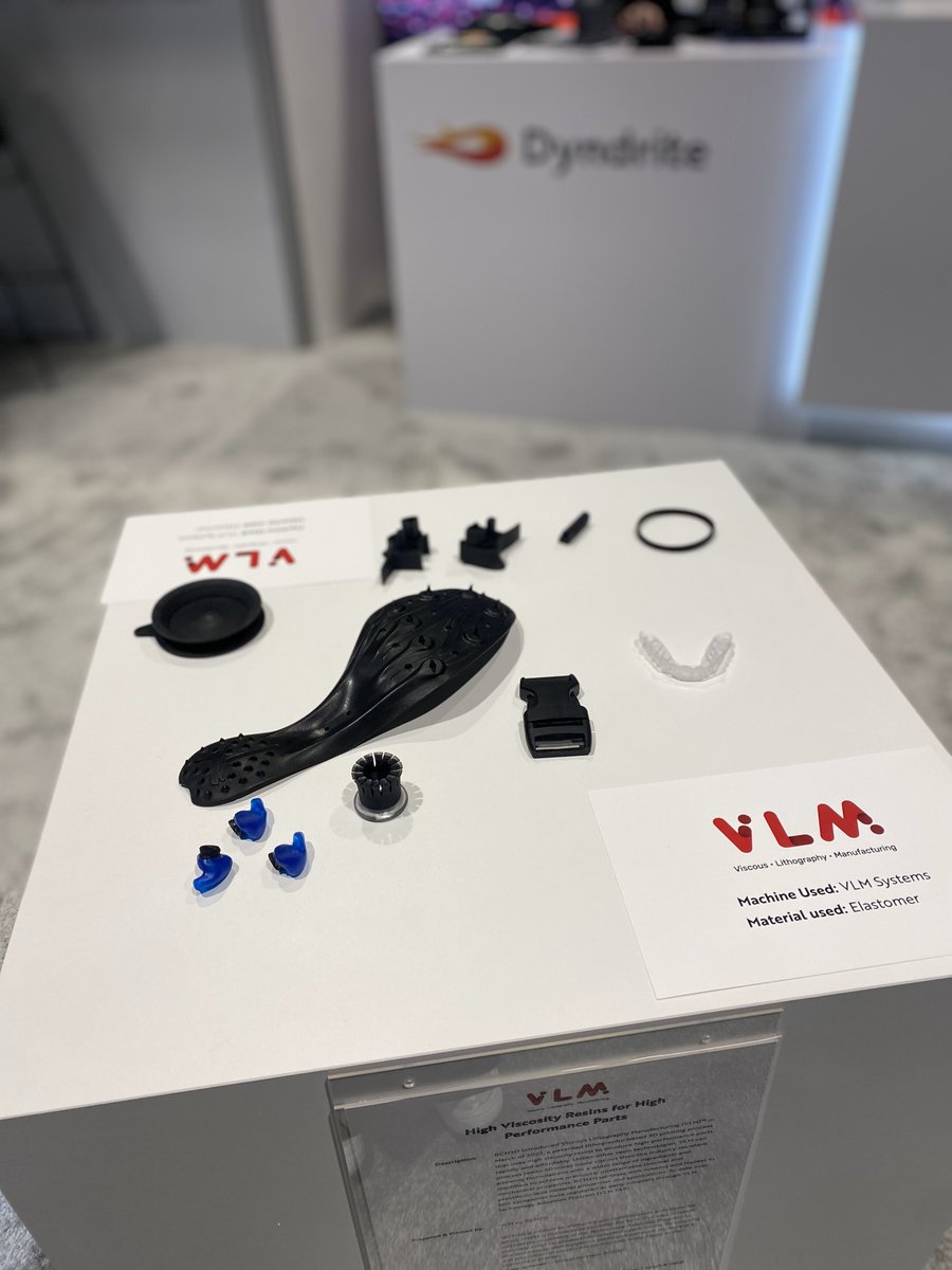 Dyndrite and @bcn3dtech display examples of VLM high viscosity resin for high performance parts at #Rapid+TCT 2023 Printed on VLM System, using high rebound elastomer and HDT, the hearing aids biocompatible materials. #additivemanufacturing #3Dmetalprinting #resin