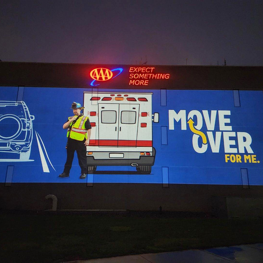 AAA_Michigan's tweet photo. AAA is lighting up our Michigan HQ to remind drivers to slow down & move over when seeing a broken-down or emergency vehicle on the roadside. Play your part in getting them home safely. #WeAreAAA #MoveOverForMe https://t.co/wlh4PezbUZ