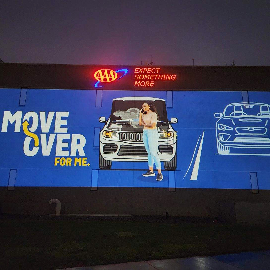 AAA_Michigan's tweet photo. AAA is lighting up our Michigan HQ to remind drivers to slow down & move over when seeing a broken-down or emergency vehicle on the roadside. Play your part in getting them home safely. #WeAreAAA #MoveOverForMe https://t.co/wlh4PezbUZ