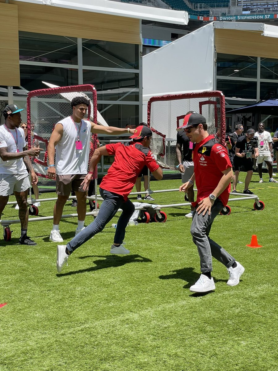 LeclercNews's tweet photo. Charles &amp; Carlos playing with the @MiamiDolphins today 😅

📸 x @maribecker 

#MiamiGP https://t.co/yWI48dU2aI