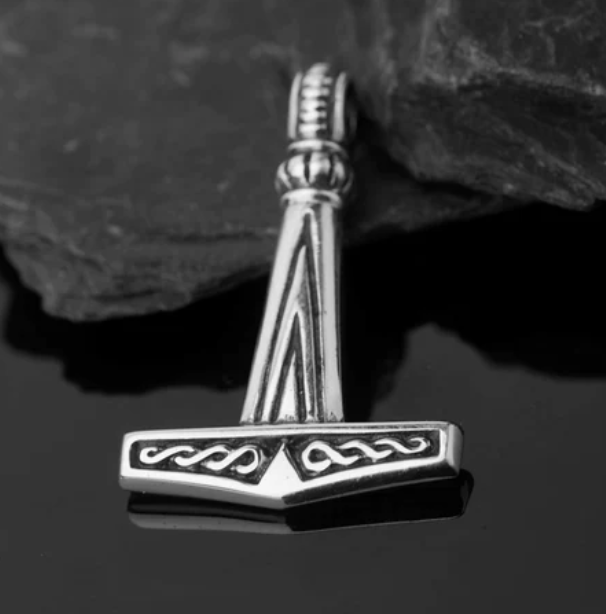 A more plain Thor's hammer design made of silver that was found at Pålstorp in southern Sweden and dated to the 10th century. The second picture shows a reconstruction by Grimfrost. #GermanicHeritage