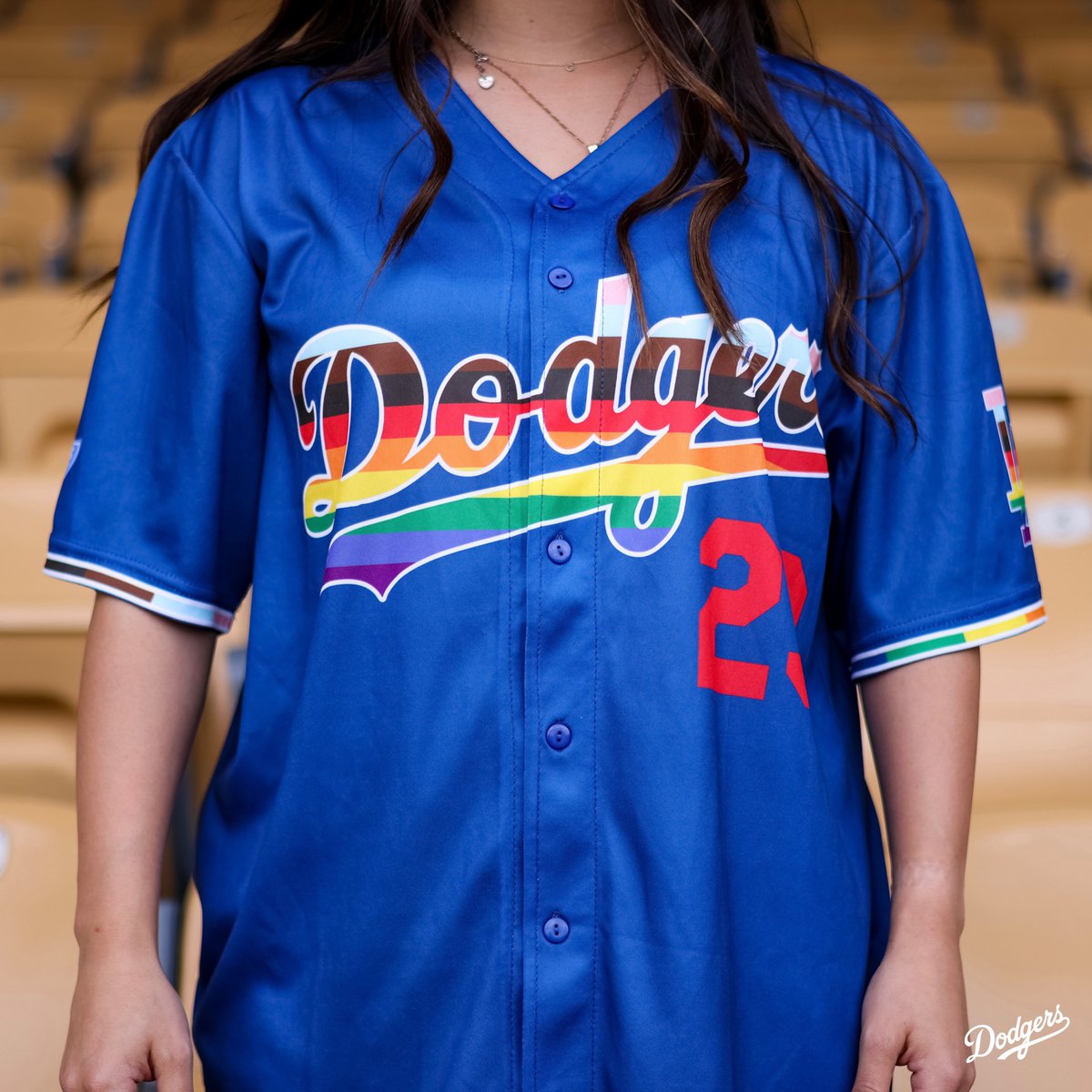 Dodgers's tweet image. Celebrate LGBTQ+ Pride Night at Dodger Stadium on 6/16 presented by @BlueShieldCA! Before the game, join us in the Centerfield Plaza for our @lapride party. To get this exclusive jersey, purchase a special ticket pack now at Dodgers.com/lapride.
