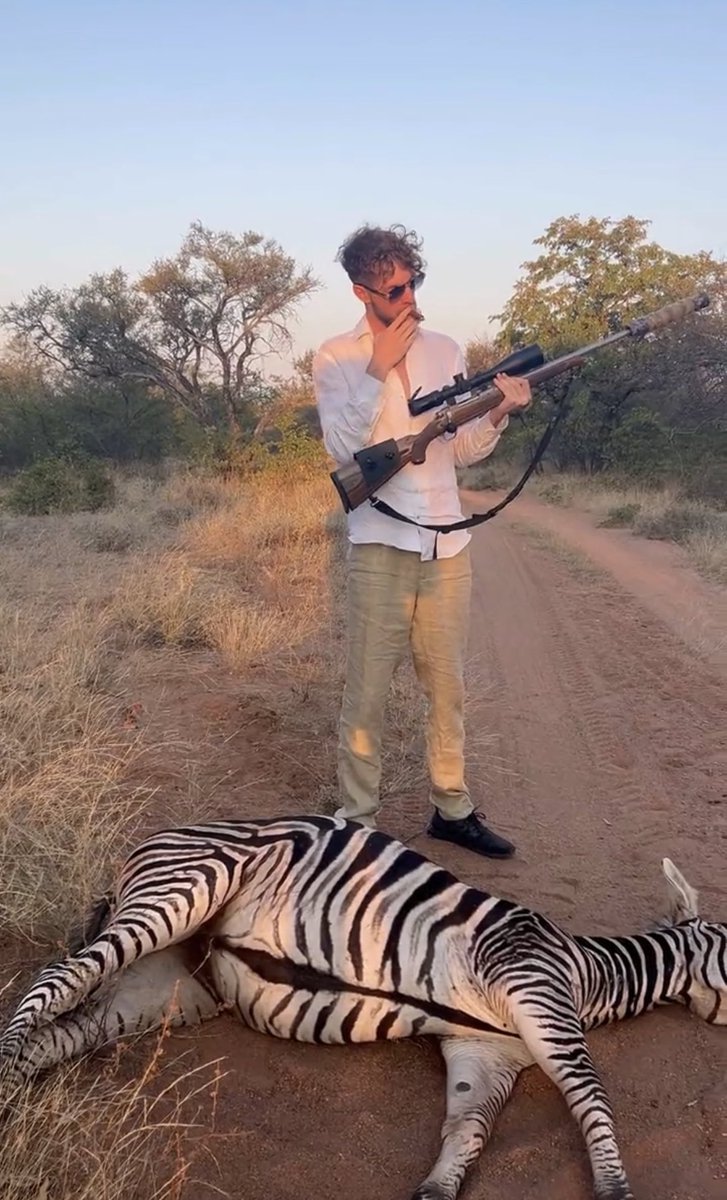 a_toots's tweet photo. This deplorable cunt again. Not content with trying to raise his social media profile by spending $7,000 on a lighter and buying a tiger, he’s now blown away a zebra under the bullshit guise of giving in to his primal instincts. Kill or be killed? Was the zebra armed? Utter twat. https://t.co/EyV3uqYesV