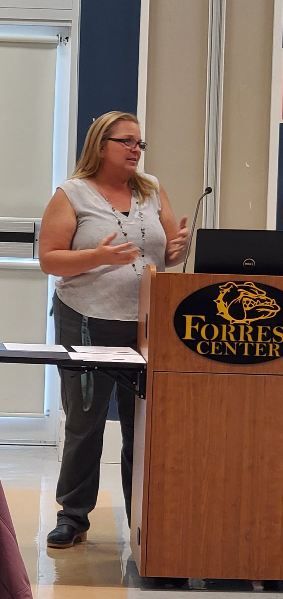 Melissa Chew, TAM Instructor brings greetings to a young student audience at the Inaugural Teacher Academy Prospective Scholars (TAPS) Night at the Forest Center.