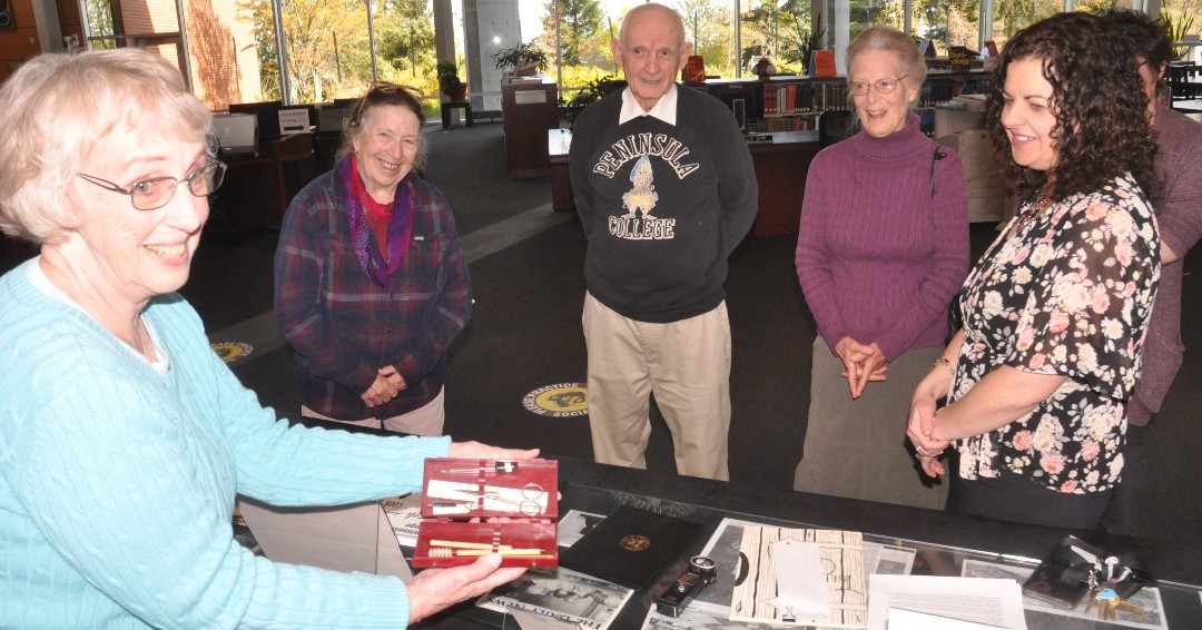 pencollege's tweet image. Graduates from the  Peninsula College class of 1963 shared college memorabilia with PC President Dr. Suzy Ames in the library on Tuesday. Videographer Elijah Sussman was on hand to film Suzy and the alumni as they toured campus.
Come see us again!

#PCAlumni 

📷 Rich Riski
