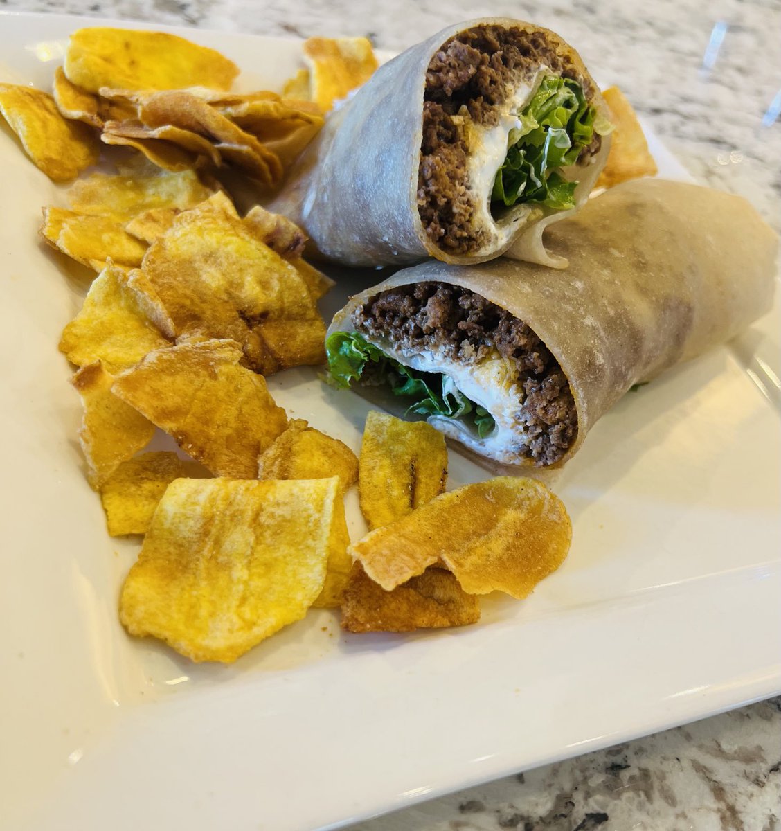Seasoned grass fed/finished beef in cassava wrap with organic sour cream, goat mozzarella, and greens. Plantain chips. Husband loves this. #smallchanges
