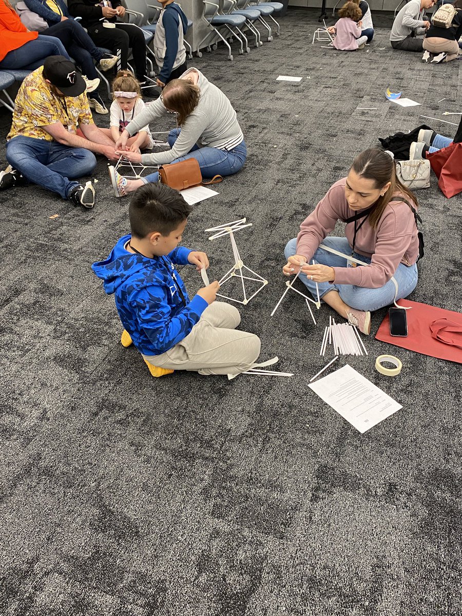 IDA_org's tweet photo. Teamwork makes the dream work! @ACPSk12 students and their parents are tasked with building the tallest free-standing tower possible from 50 drinking straws and masking tape. #ScienceUnrestricted @acpsFACE https://t.co/9KZN73yHQB