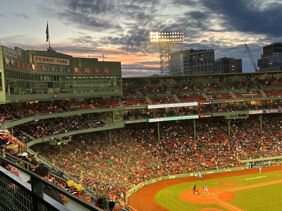 MLB_BaseballSky's tweet photo. RT @jtackeff: A very nice #baseballsky sunset breaking through the dense cloud cover at the @redsox game tonight. https://t.co/xY3K1LKHZf