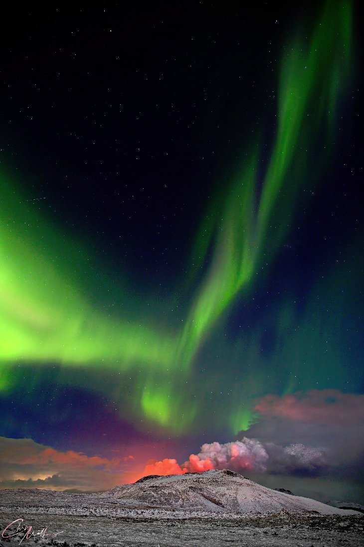KlatuBaradaNiko's tweet photo. Once-in-a-lifetime shot of the aurora borealis dancing above an erupting volcano, Iceland  

#photography by Christopher Mathews https://t.co/ucWwG4Kjm8