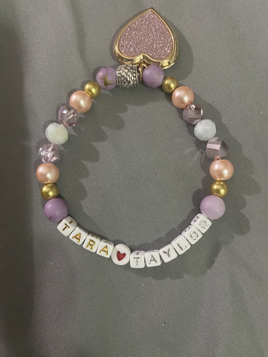 TayruhBee's tweet photo. On the chance I can hand this to @taylorswift13 or throw to her on stage or give to Andrea or Scott to give to her I made a bracelet with a locket so I could put a little note in 🥹 now we just have to finish Greg’s diy costume for #ERASTOURNASHVILLE tomorrow!! @taylornation13 https://t.co/a58pX90ICx