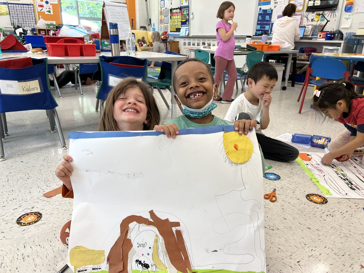Kindergarten scientists show off their ant habitats.