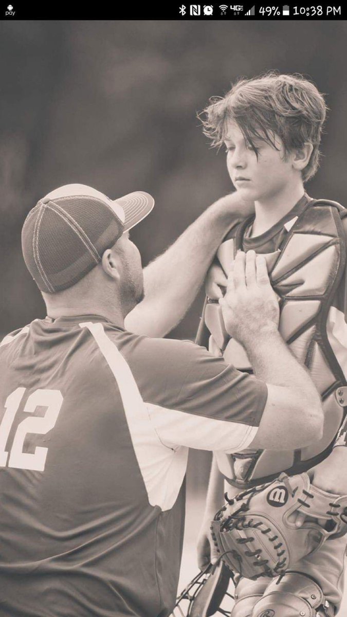 " As they leave the field under the sun’s last ray of light,
A bittersweet moment is captured in black and white.
A father and son, arm in arm, so tight,
Their love for each other is forever in plain sight.

Baseball may have come and gone,
but their love for each other is
