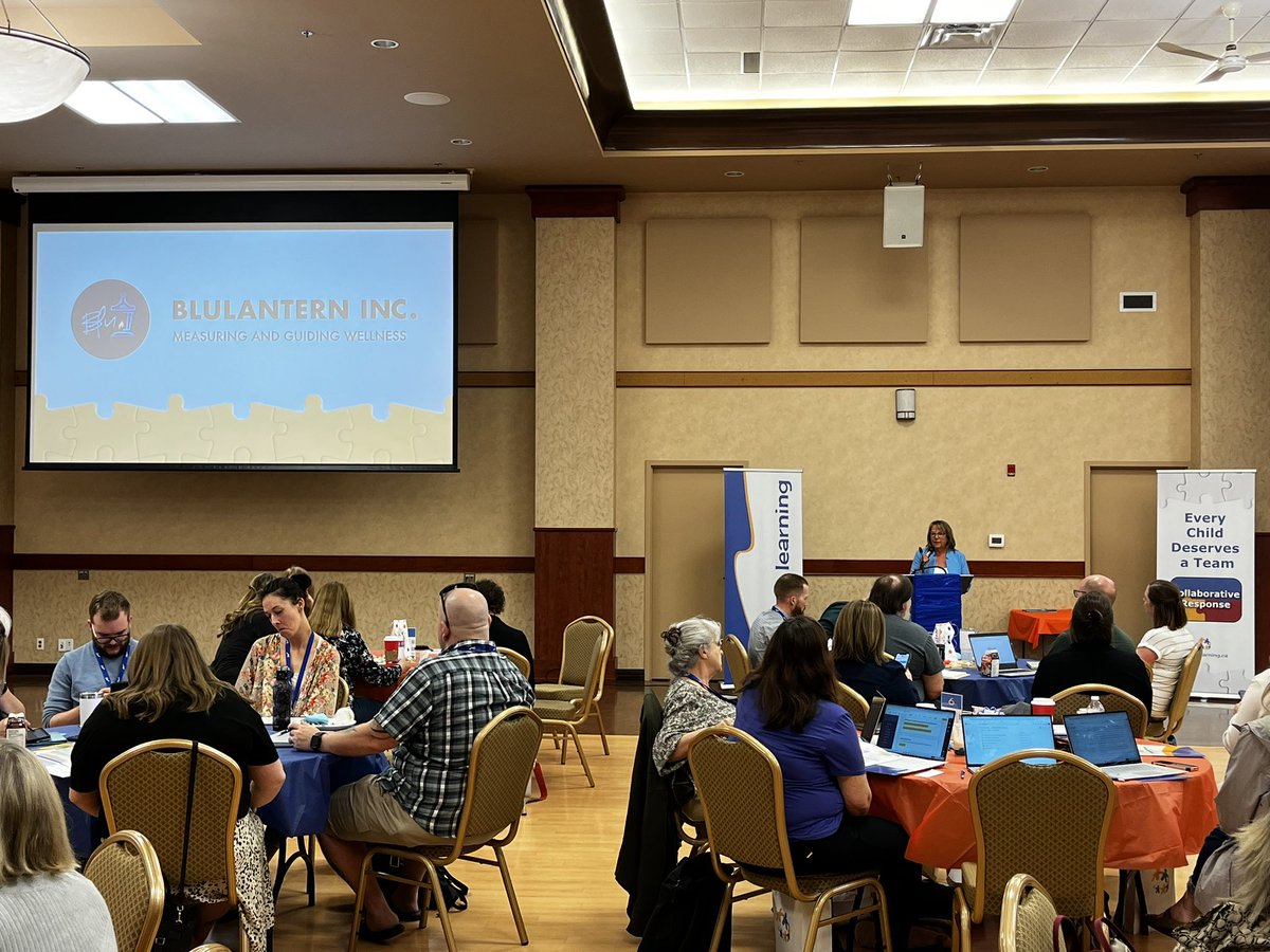 _MrsFerguson_'s tweet photo. @LeslieRonaldson of BluLantern addresses #collaborativeresponse Retreat participants to introduce both the Beacon4+ Wellness Data Collection Tool as well as todayβs keynote presenters, @hewsonk27 and @LornaHewson! @Jigsaw_Learning https://t.co/qDXptg7LqQ