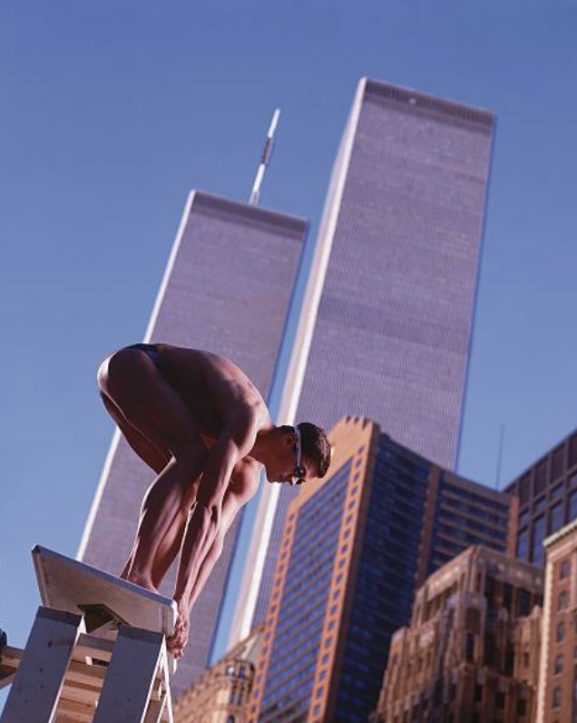 ThrillVictory's tweet photo. Swimming champion Alexander Popov poses with the World Trade Center in the background in advertisements for the 1998 Goodwill Games in New York. Aleksandr won Gold & Silver in individual swim events. #AlexanderPopov #Swimming #swim #WorldTradeCenter #GoodwillGames #NewYork #NY https://t.co/dCyCt51UTf