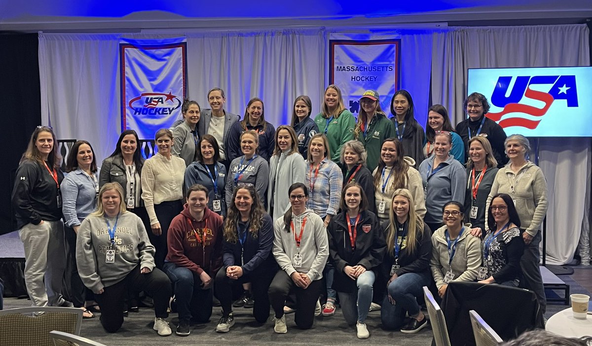 Coach Chelsea with the female coaches at our coaching symposium and four members of the 1998 gold medal USA hockey team.