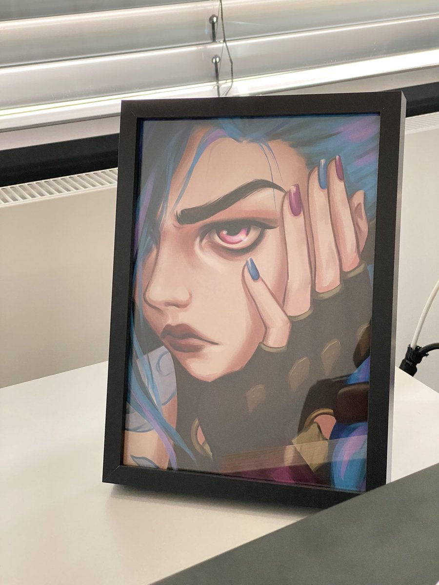 Draneas's tweet photo. I got myself some pictures from @Rhien_art at MMC last week, got some frames and hung them on my chaotic walls. Jinx has a special place at work, though. 😊 
I’m happy to have met her, she’s such a nice person and very humble! https://t.co/Xd5JNTq7pQ
