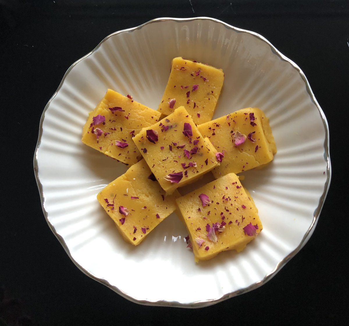Melt-in -your-mouth goodness with a tropical twist - homemade rose mango burfi 🥭🌹🥭🌹 This is a delicious treat for any occasion. The addition of fragrant rose pastels makes its even more special. #rosemangofudge #trending #mangoburfi #rosemangoburfi #viral
