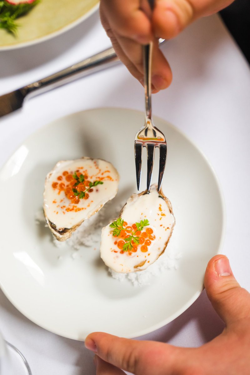 The first course of our tasting menu, Acadian Pearl Oysters, are a fresh and savory way to start your meal 🥂🦪