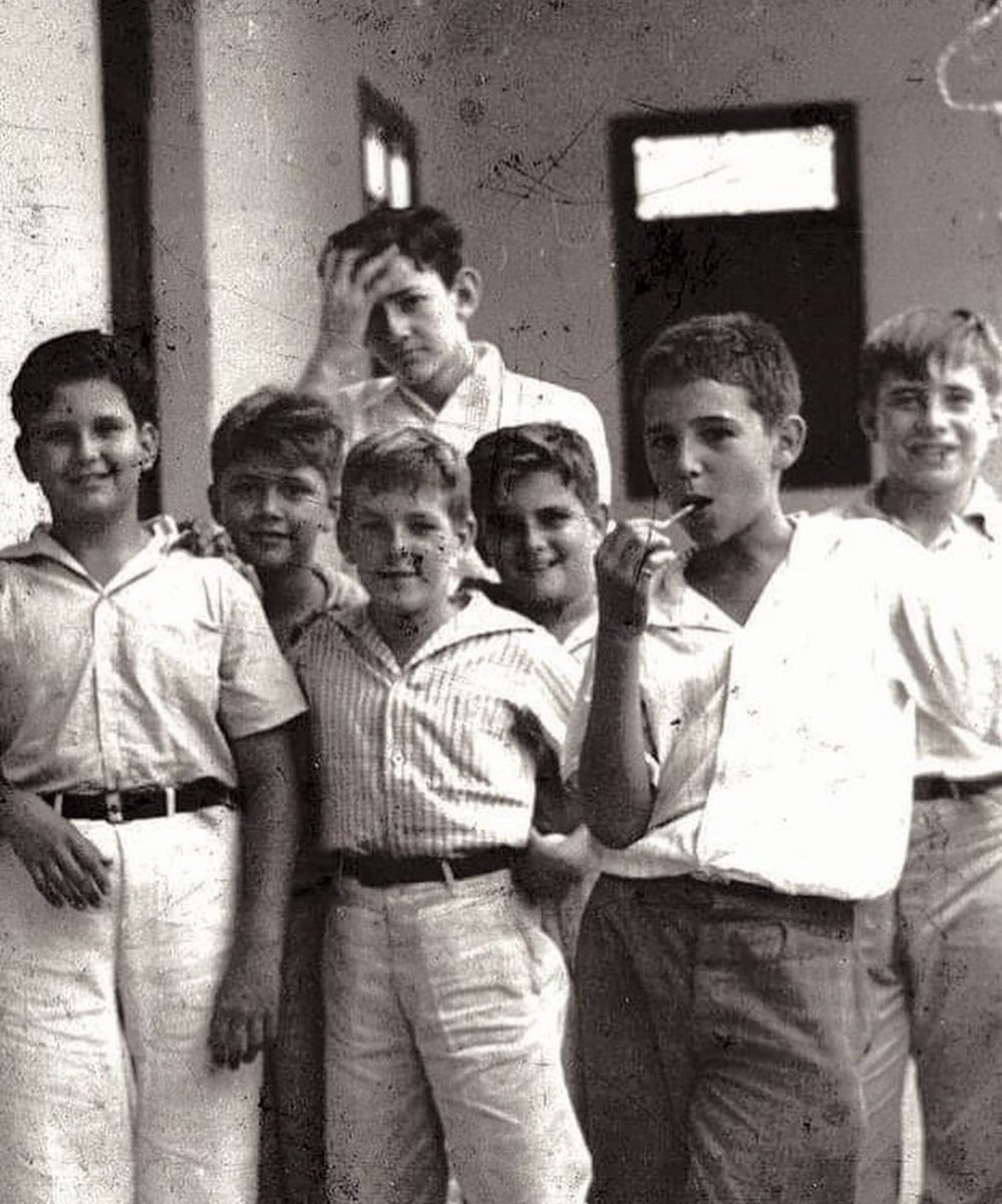 Fidel Castro in 1937 (the one with the lollipop).