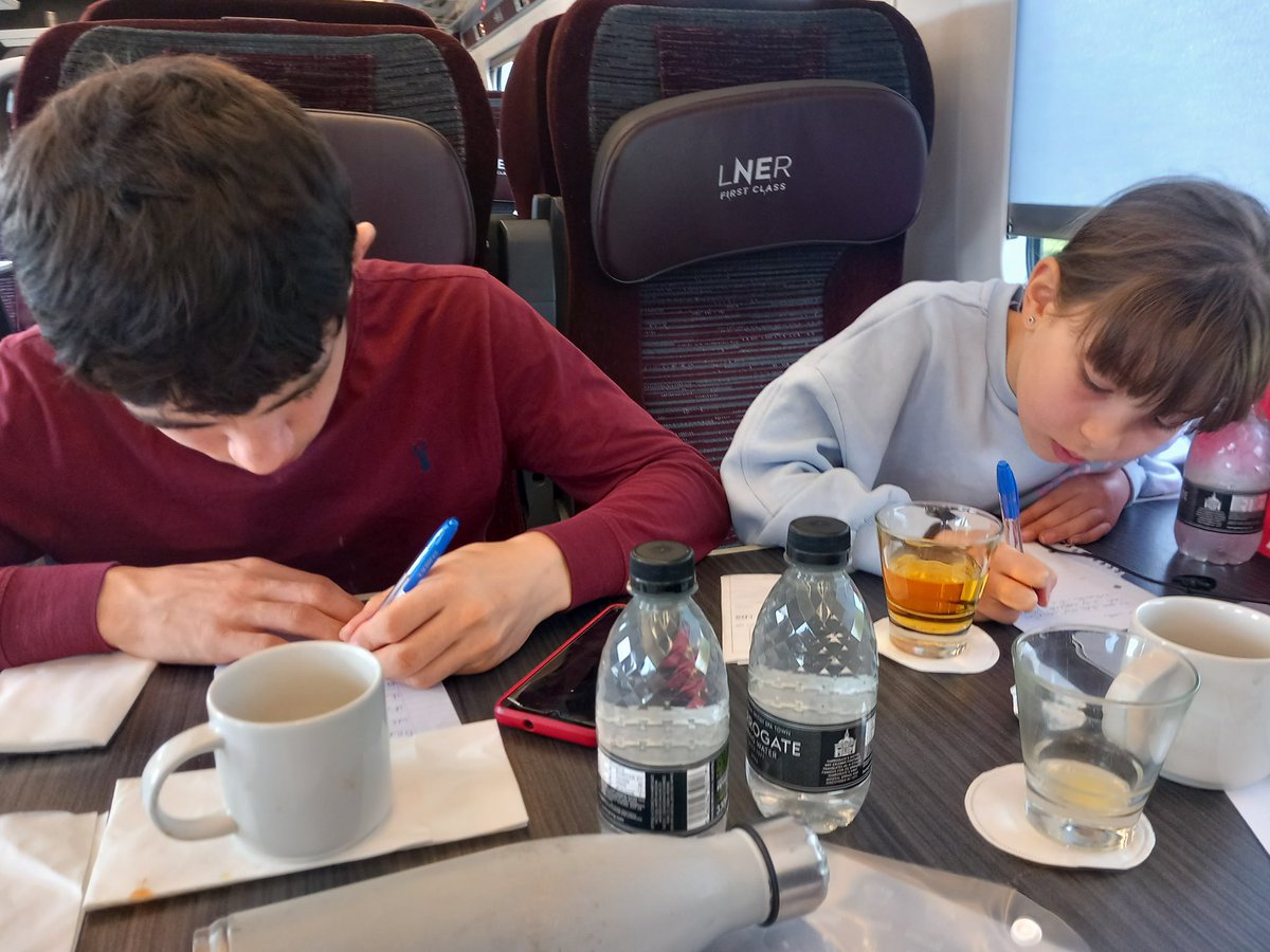 Coronation excitement intensifies - two of our young people busy composing their prayers for our grand Service of Celebration on Sunday evening, while on their way down to London for the big day. Great work!