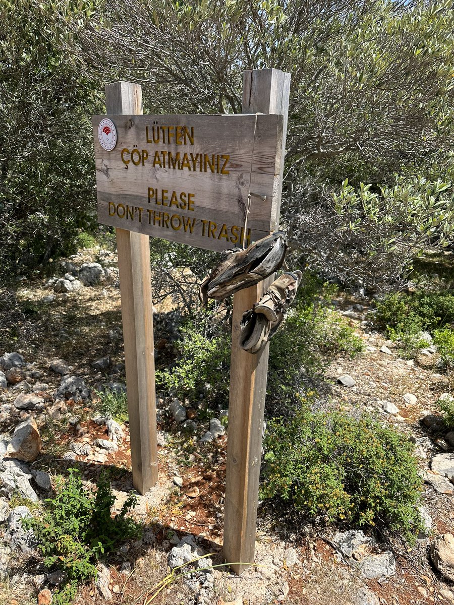 It’s been a while <a href="/abandonedshoes/">abandonedshoespotter</a> - this pair were hanging from a sign on the Lycian Way in Turkey.