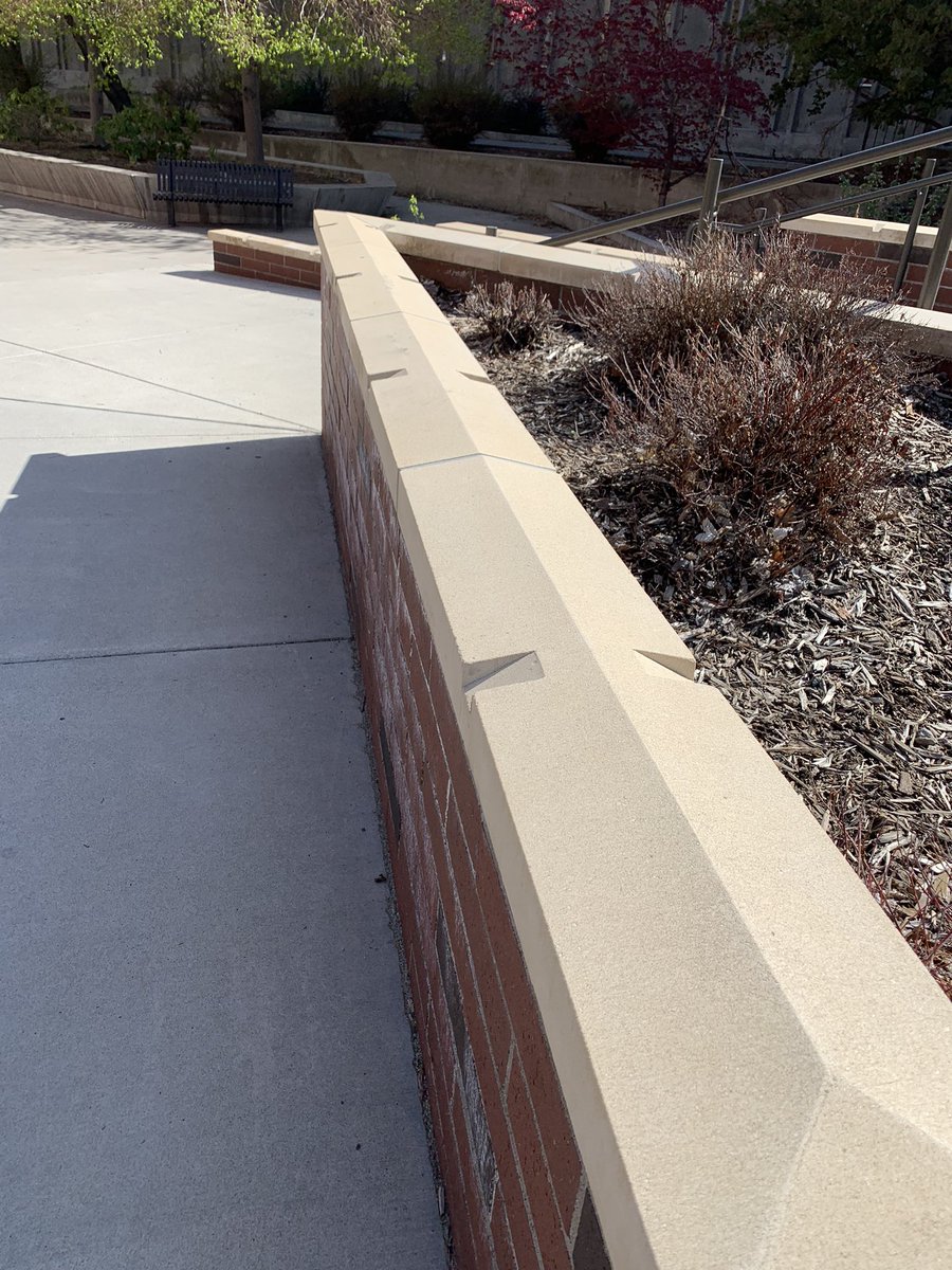 kadecraving's tweet photo. Noticed some unpleasant architecture throughout my various strolls on campus. Ran into the infamous anti-homeless homeless man bench. I’ve also noticed these slanted ledges with divots in them. They’re uncomfortable to sit on for long and their divots prevent skating #rsj108 https://t.co/5JWHuqrs2M