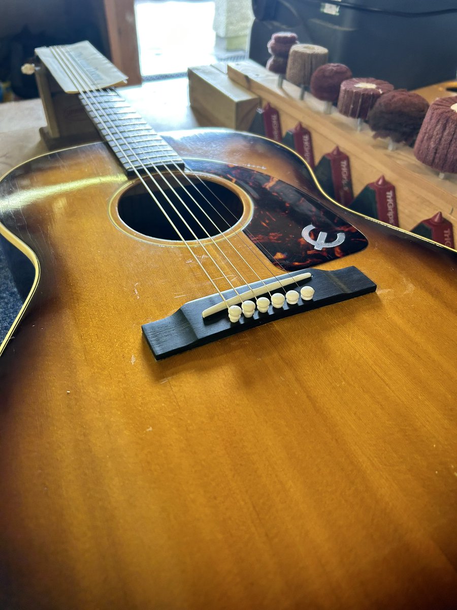 GuitarDoctorUK's tweet photo. Beautiful old Epiphone built by Gibson long ago. Plastic bridge?!! Here's a job I do often, make a new bridge from an ebony blank, exactly to the original's spec 🤙🎸🗜️ #guitar #guitarsofinstagram #guitarrepair #loothing #theloothgroup #luthier https://t.co/D1CVmi7kBX