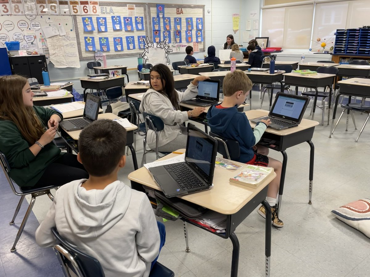 Our 4 math groups working hard to review classifying shapes during centers today.