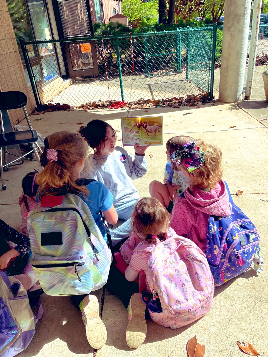 Caught this sweet 5th grader (and carpool helper) reading a book to some Kindergartners while they waited to get picked up this afternoon.  <a href="/cary_elementary/">Cary Elementary</a>