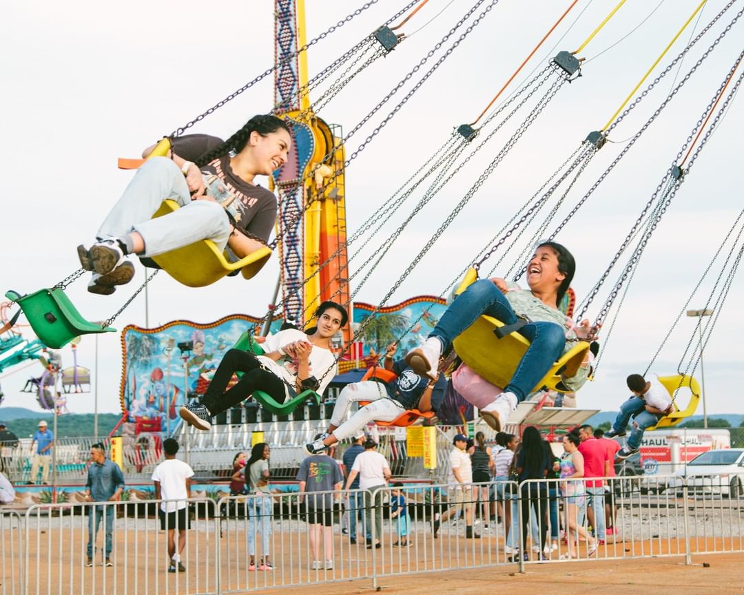 CarrolltonFair's tweet photo. A little rain won't slow us down ☔️ The gates are officially OPEN and we can't wait for you to join us! 🎉🎡🎠 Grab your go-to fair buddies and head to the #OpeningNight of the #CarrolltonFair! https://t.co/a64buvXPCr