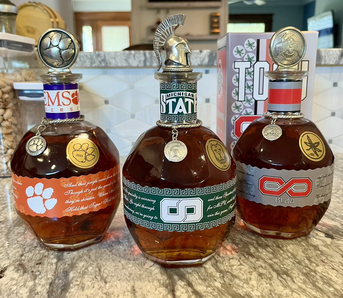 GarrettPatrick1's tweet photo. OSU buddy is getting married, so I combined my love of packaging &amp; bourbon and made him an infinity bottle for the wedding. 

Naturally had to make MSU and Clemson ones for myself. Pretty stoked how they all turned out. https://t.co/xyivXxPpEj