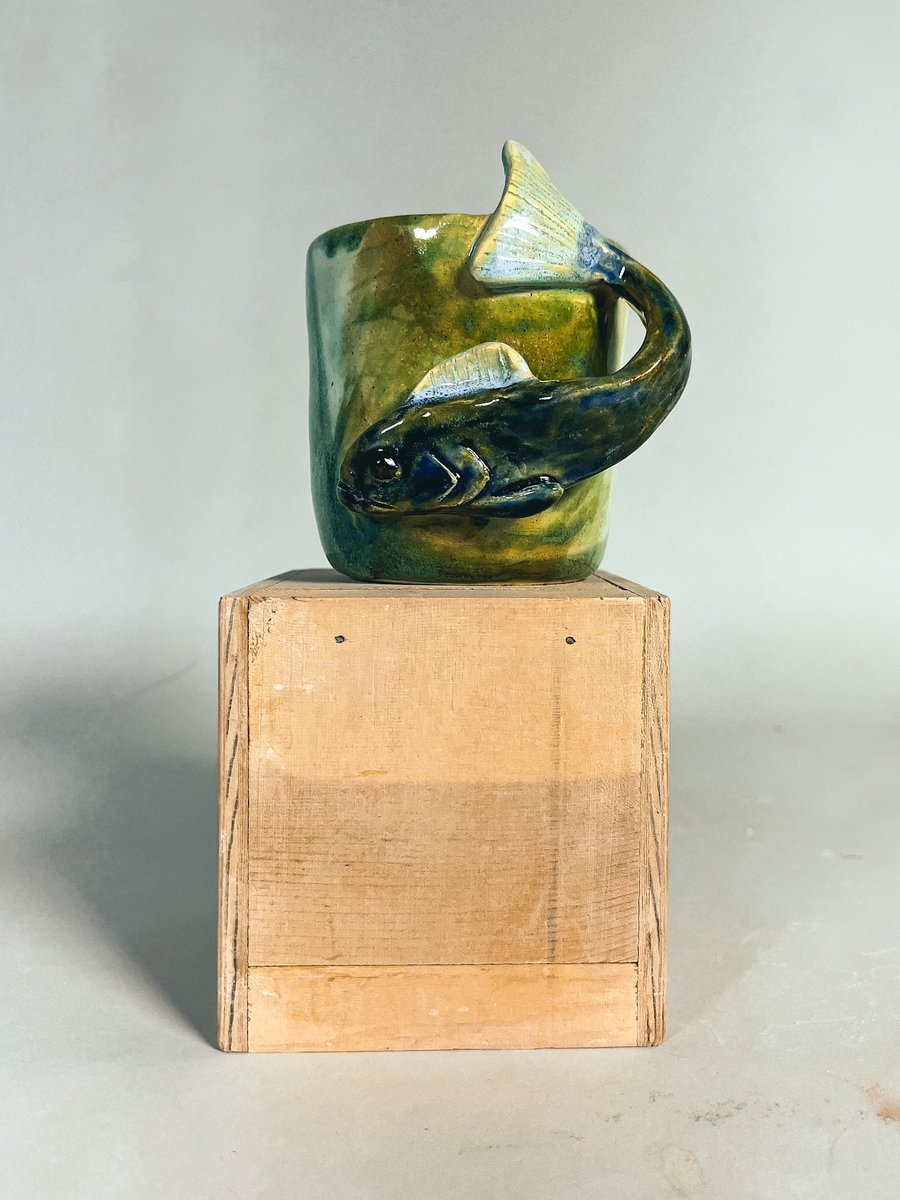 5tar_kid's tweet photo. These mugs I think really convey my styles when it comes to ceramics. Sculptural work, careful glaze work, and silly guys. https://t.co/RG1GTdGumy