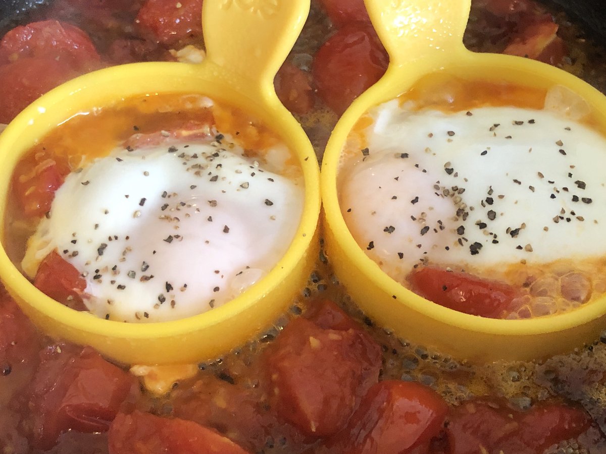 Gently shallow fry toms in olive oil, add salt sugar and vinegar, where possible use the vines to add flavour.  Add a few flakes of chilli, pinch of smoked paprika.  Then grated ginger.  Reduce for about 5 mins, add eggs and cover pan.  Remove vines.  Serve when cooked.
Enjoy.