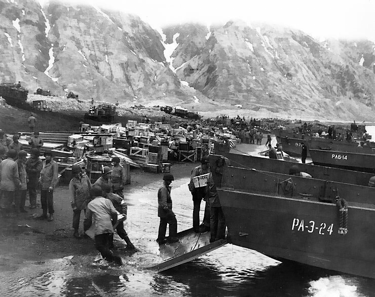 May 13, 1943: Amid Japanese resistance, US troops unload supplies in two invasion zones on the island of Attu, northern Pacific