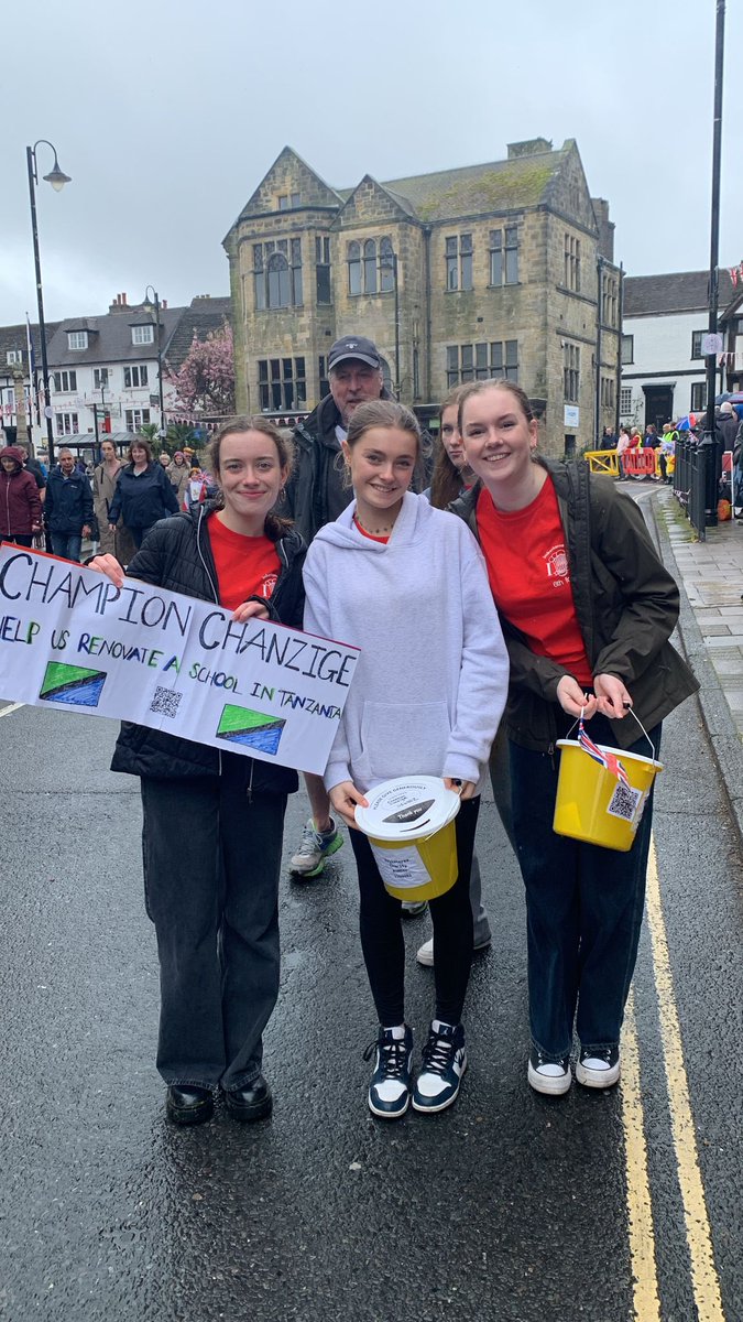 Imberhorne6th's tweet photo. Good to see our students representing us and supporting @ChanzigeA in the coronation parade in town today ☔️ https://t.co/39yHM496bH