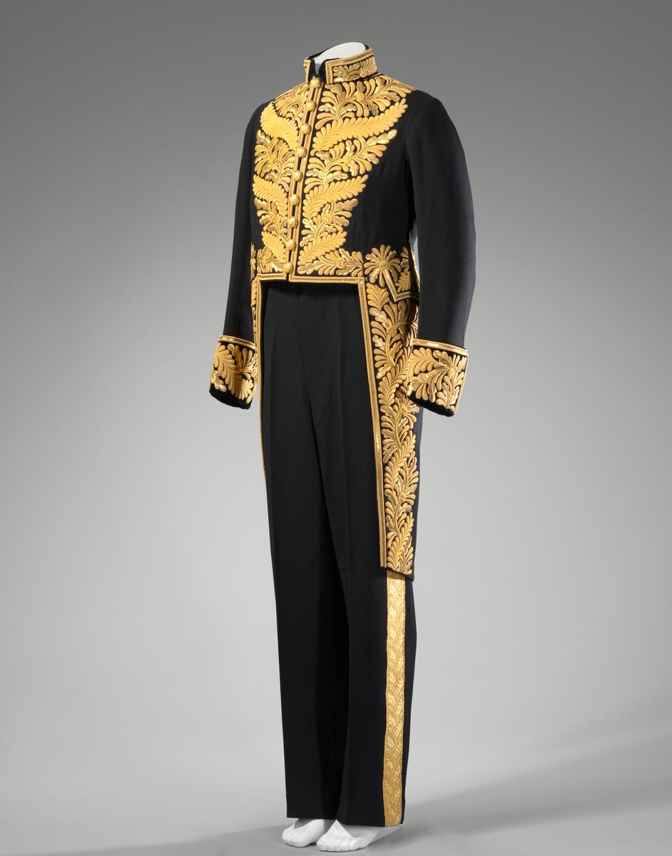 Tony_Diver's tweet photo. Penny Mordaunt has had her dress and hat for the coronation custom embroidered with gold ferns -- a nod to the Privy Councillor's uniform.

The colour, by designer Safiyaa, is "Poseidon", a reference to her Portsmouth constituency. https://t.co/7aiqjlEHXc