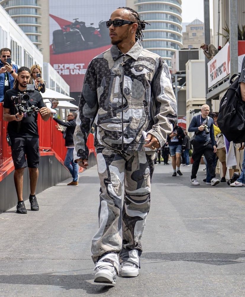 Lewis Hamilton pictured outside of his pop-up at Alchemist, wearing head-to-toe  Louis Vuitton. Hamilton stopped by the District Sunday…