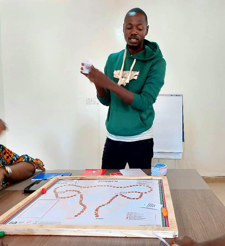 GirlsPrideGam's tweet image. Alagie Gaye, Field Coordinator for #SSWH demonstrating to his team members and project supervisors how to use the Funneh board game to learn about Teenage Pregnancy &amp;amp; Child Marriage.
#Evaluation #SimulationExercise #ToT #Gamification #TabooTopics
#SSWH #EarlyMarriageProject #IDRC