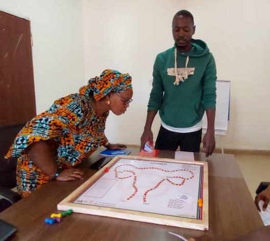 GirlsPrideGam's tweet image. Alagie Gaye, Field Coordinator for #SSWH demonstrating to his team members and project supervisors how to use the Funneh board game to learn about Teenage Pregnancy &amp;amp; Child Marriage.
#Evaluation #SimulationExercise #ToT #Gamification #TabooTopics
#SSWH #EarlyMarriageProject #IDRC